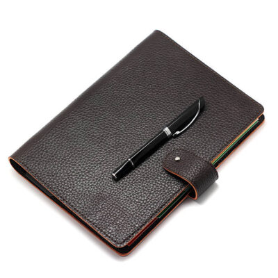 Notebook with pen isolated on white background